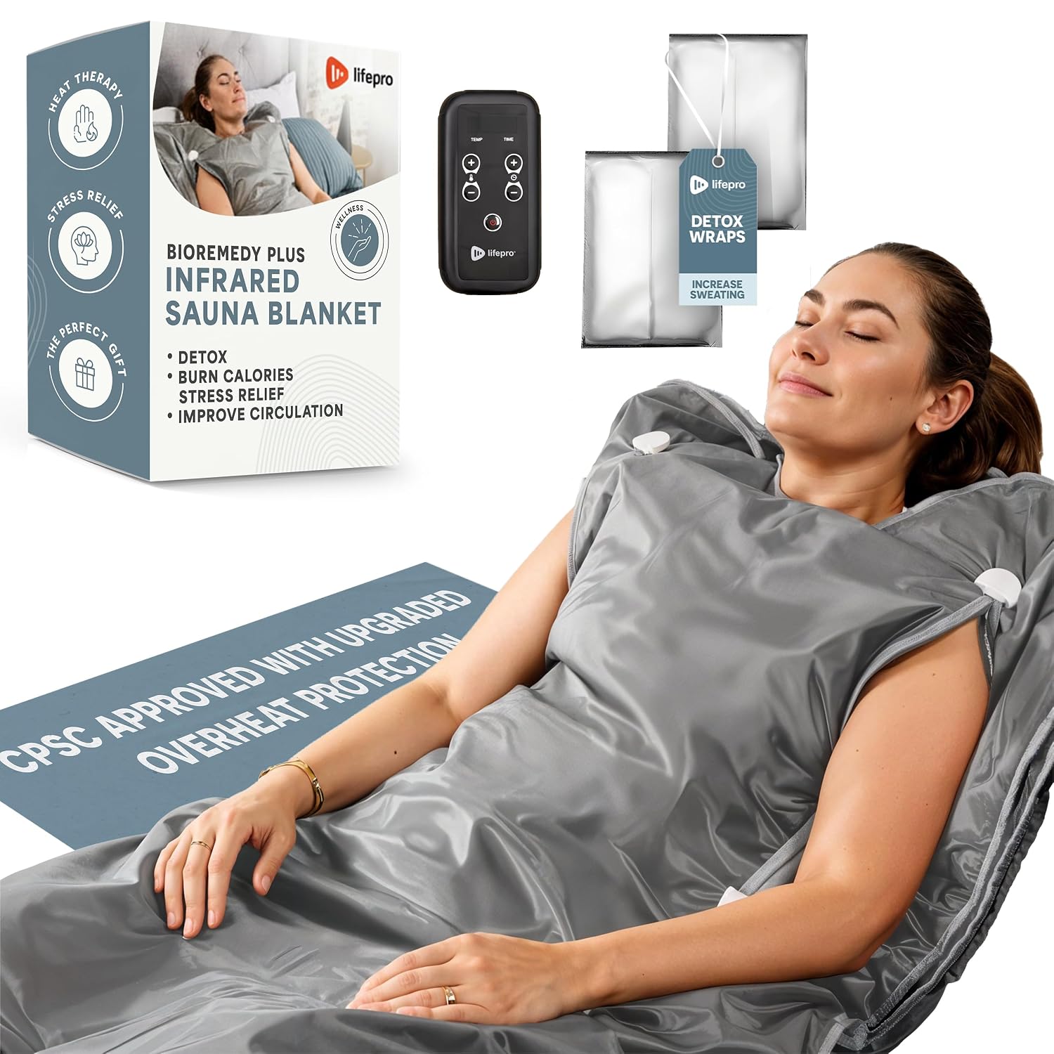 Lifepro Saunas BioRemedy Plus Infrared in gray shown with a woman relaxing remote control and detox wraps