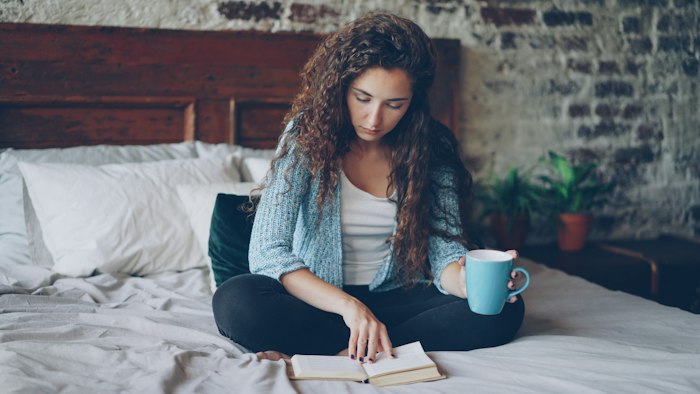 Person relaxing with coffee, calm